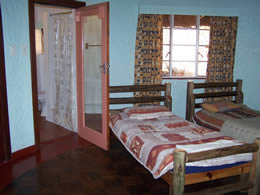 Room with four single beds and en-suite bathroom