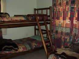 A bunk bed and single bed in one of the rooms